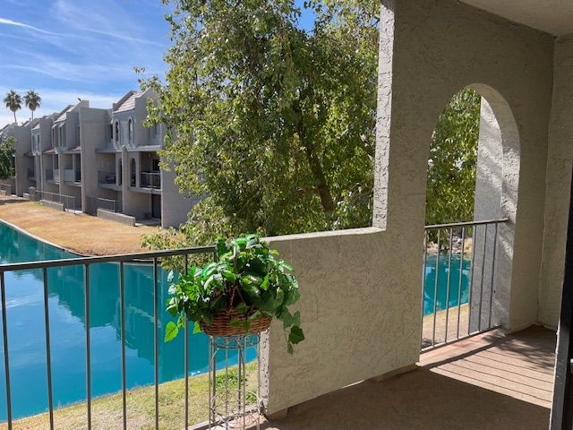 patio overlooking a lagoon in a townhome community
