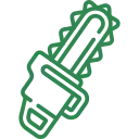 A wood chipper truck processing branches on a residential street.