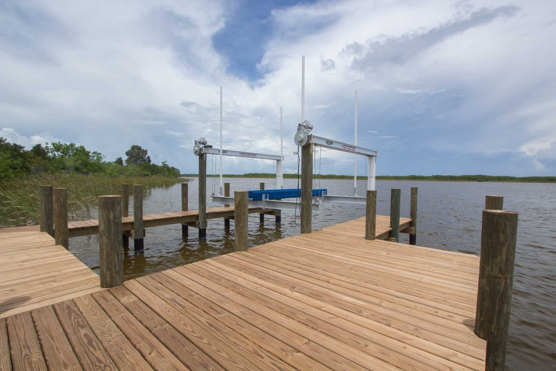 Golden SeaDrive Model Boat Lift with Custom Wraparound Dock