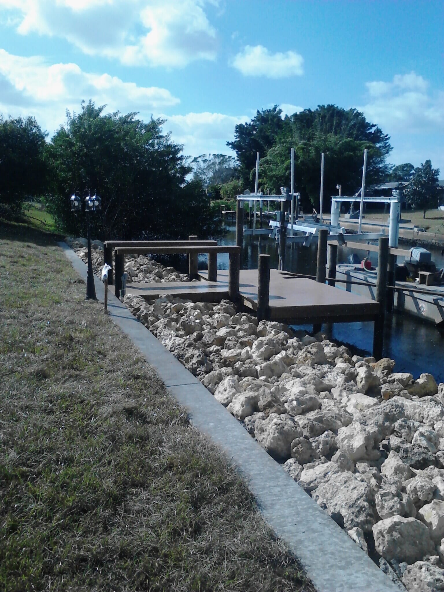 Rip Rap Seawall with Dock and Boat LIft