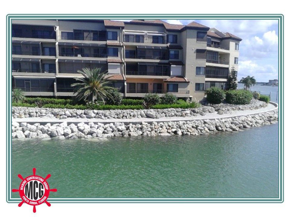 A picture of a building next to a body of water - Punta Gorda, FL - Marine Contracting Group Inc