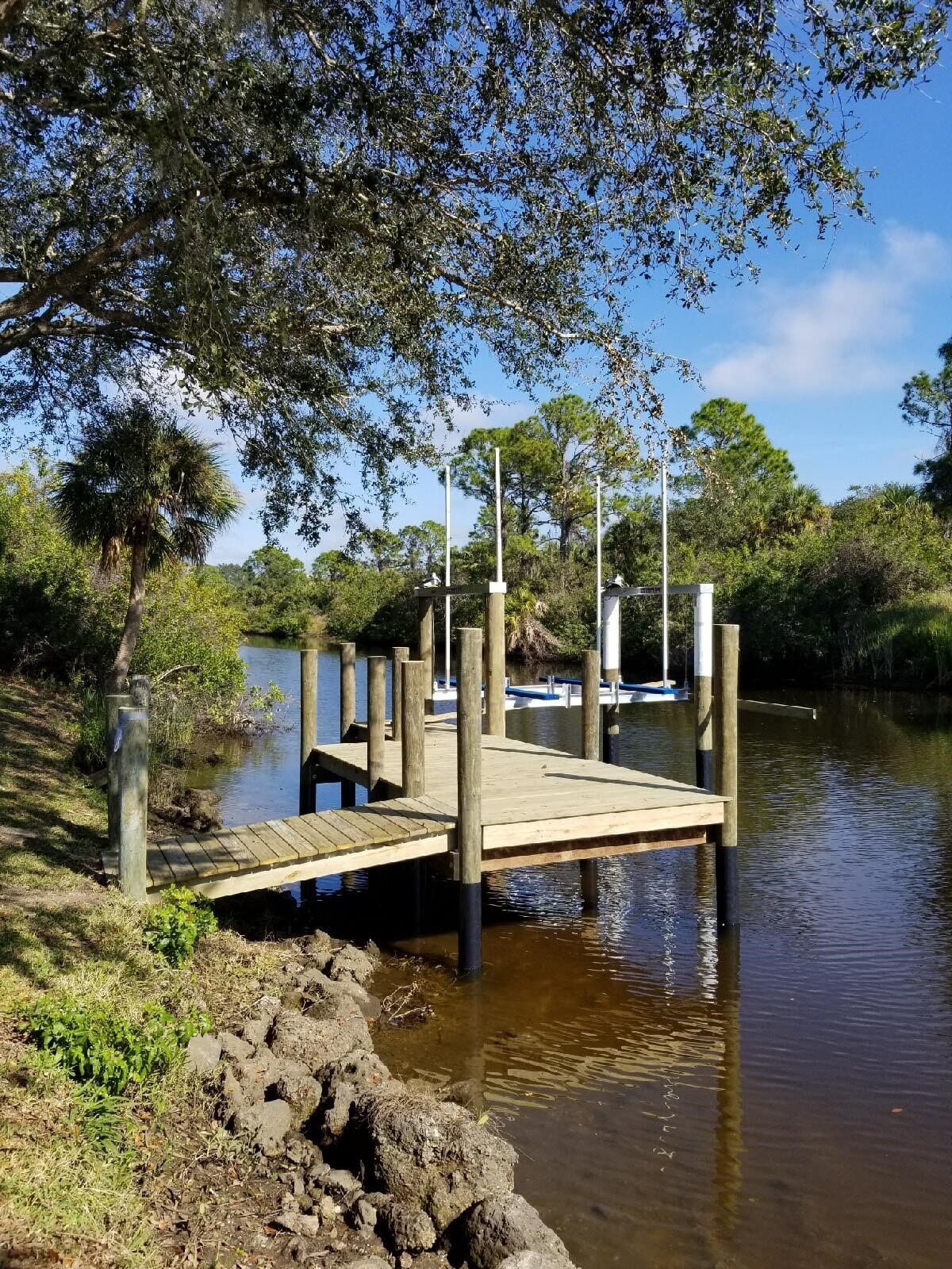 Wood dock with access way from natural bank