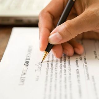 Probate Lawyer filling out a document