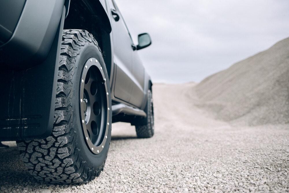A Black Truck is Parked on a Gravel Road — Precise Detailing Specialists in Emerald QLD