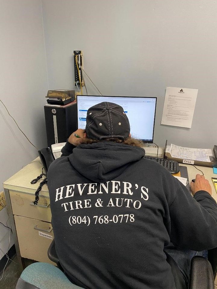 Man Working On A Computer — Chester, VA — Heveners Tire & Auto