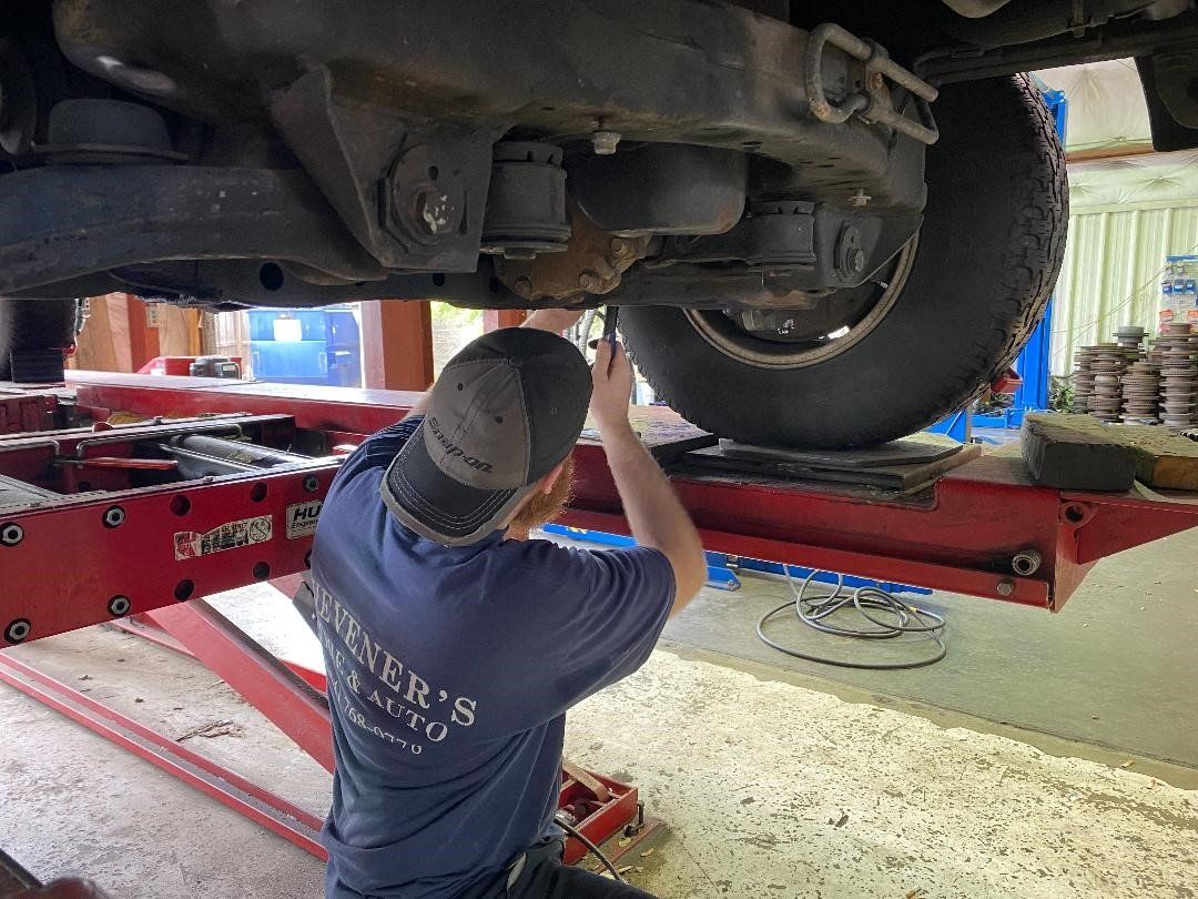 Mechanic Repair Under A Car — Chester, VA — Heveners Tire & Auto