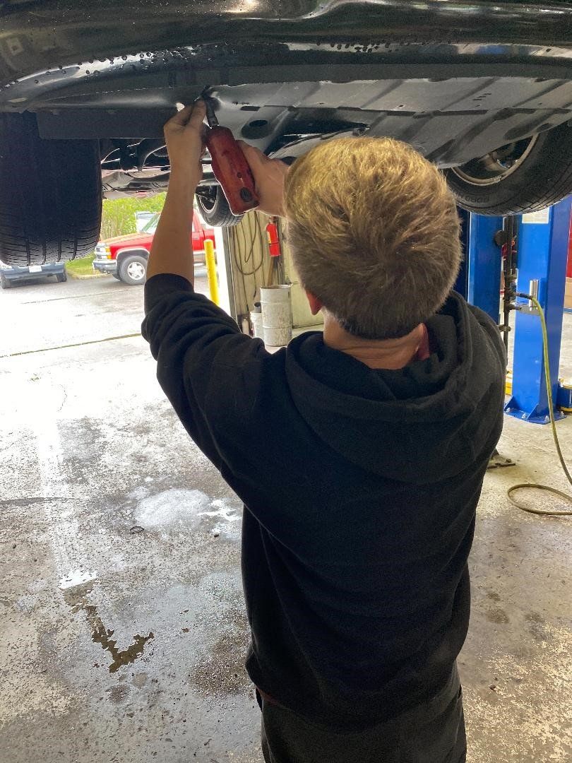 Repairing Under A Car — Chester, VA — Heveners Tire & Auto