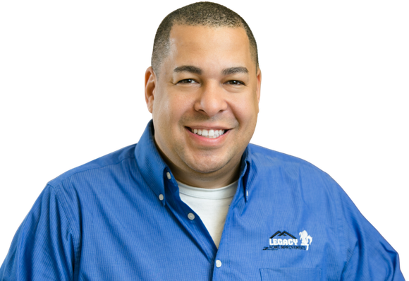 Smiling team member or representative of Legacy Home Improvements wearing a branded shirt