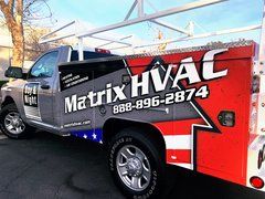 A matrix hvac truck is parked on the side of the road.