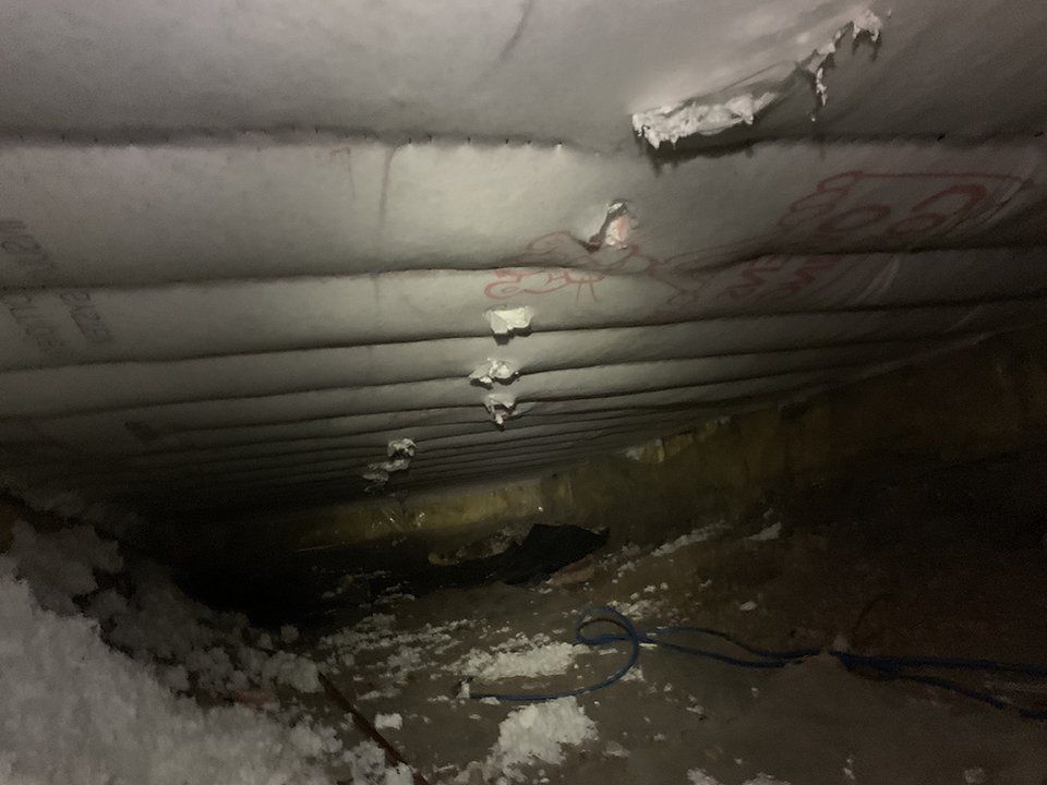 There is a hole in the ceiling of a house.