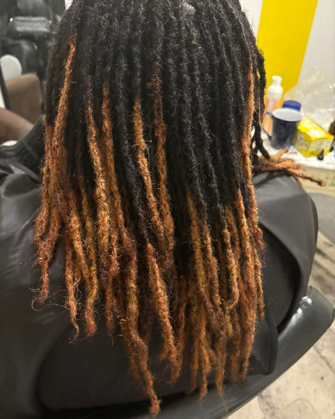 A close up of a person's hair with dreadlocks.