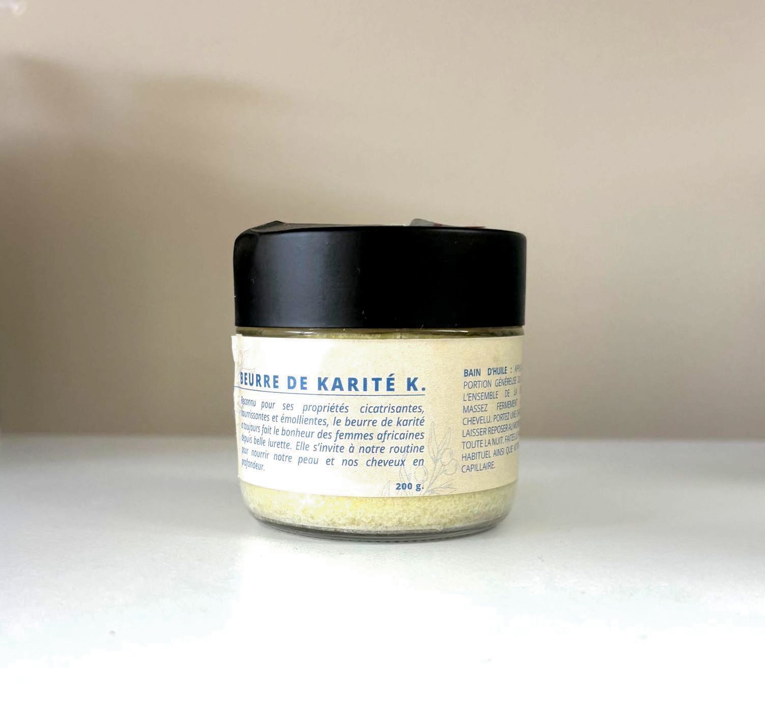 A woman with braids in her hair is sitting in front of a mirror.