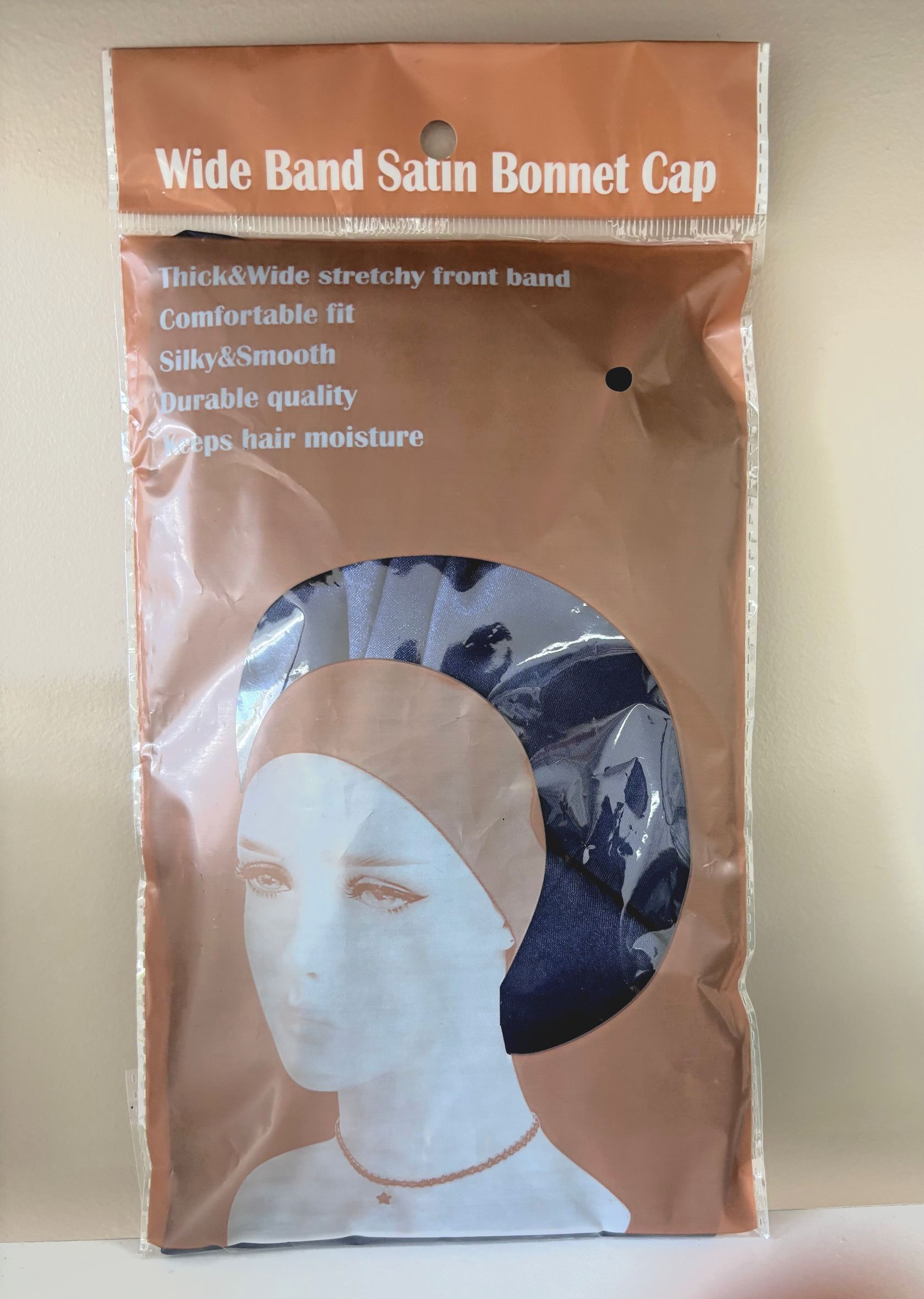 A little girl is sitting in a chair with braids in her hair.