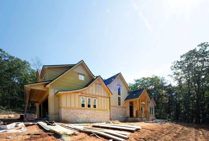 A long hallway with a row of sinks in a public restroom.