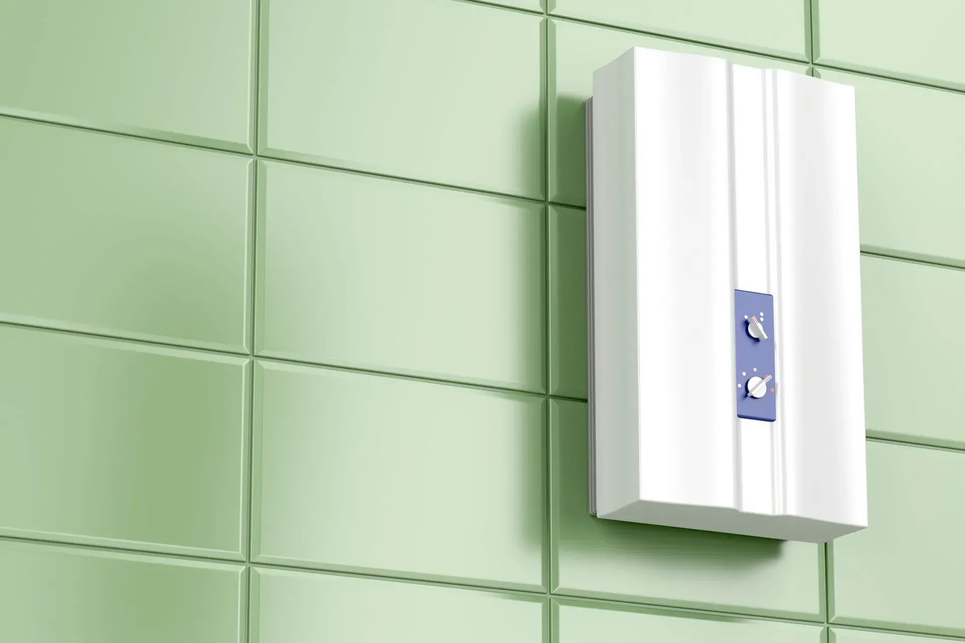 A white box is hanging on a green tiled wall.