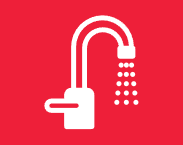 A white faucet with a shower head on a red background.