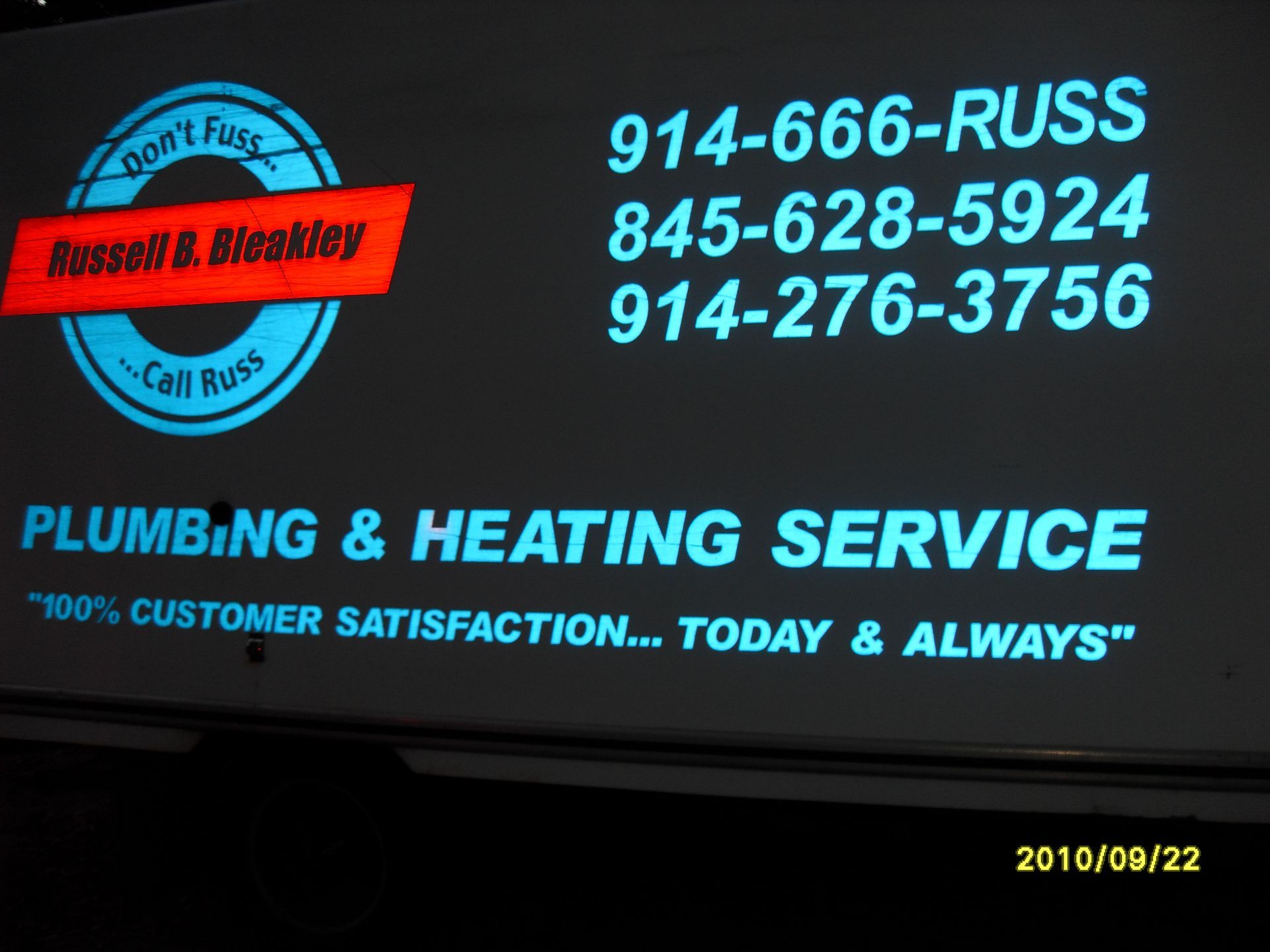 Bleakley Plumbing & Heating Service truck with contact info and slogan: 