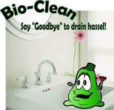 Bio-Clean advertisement: Cartoon green blob holding a plunger by a bathroom sink, saying 