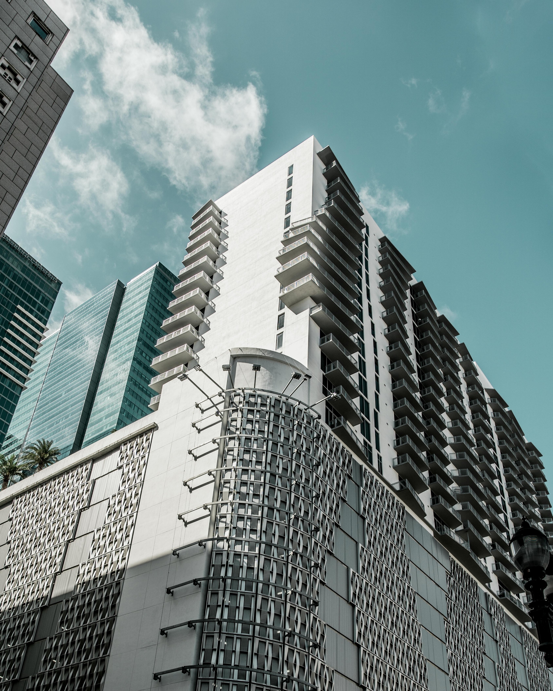 Looking up at a tall building with a blue sky in the background
