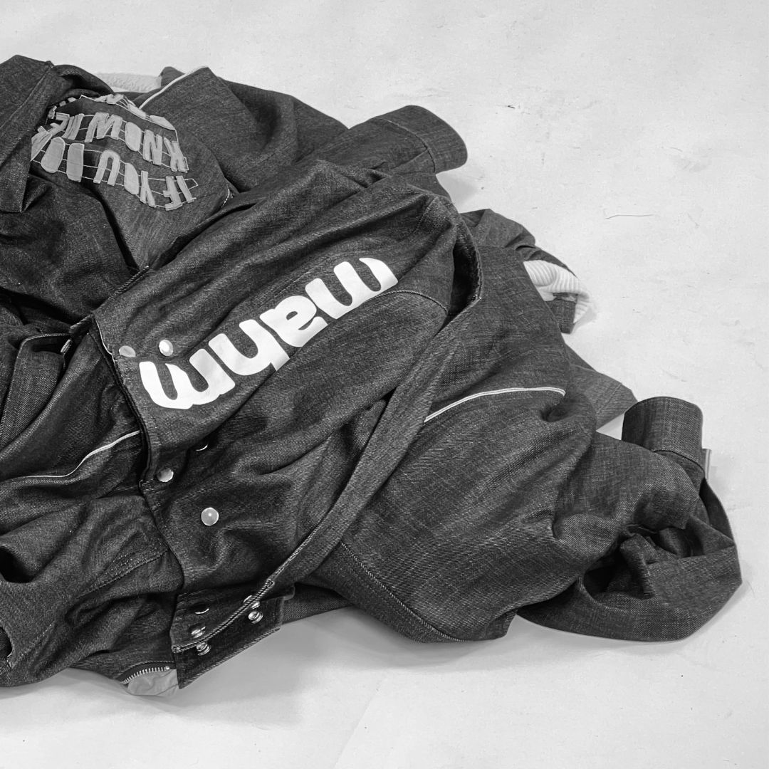 A row of bikini tops hanging on a clothes line.