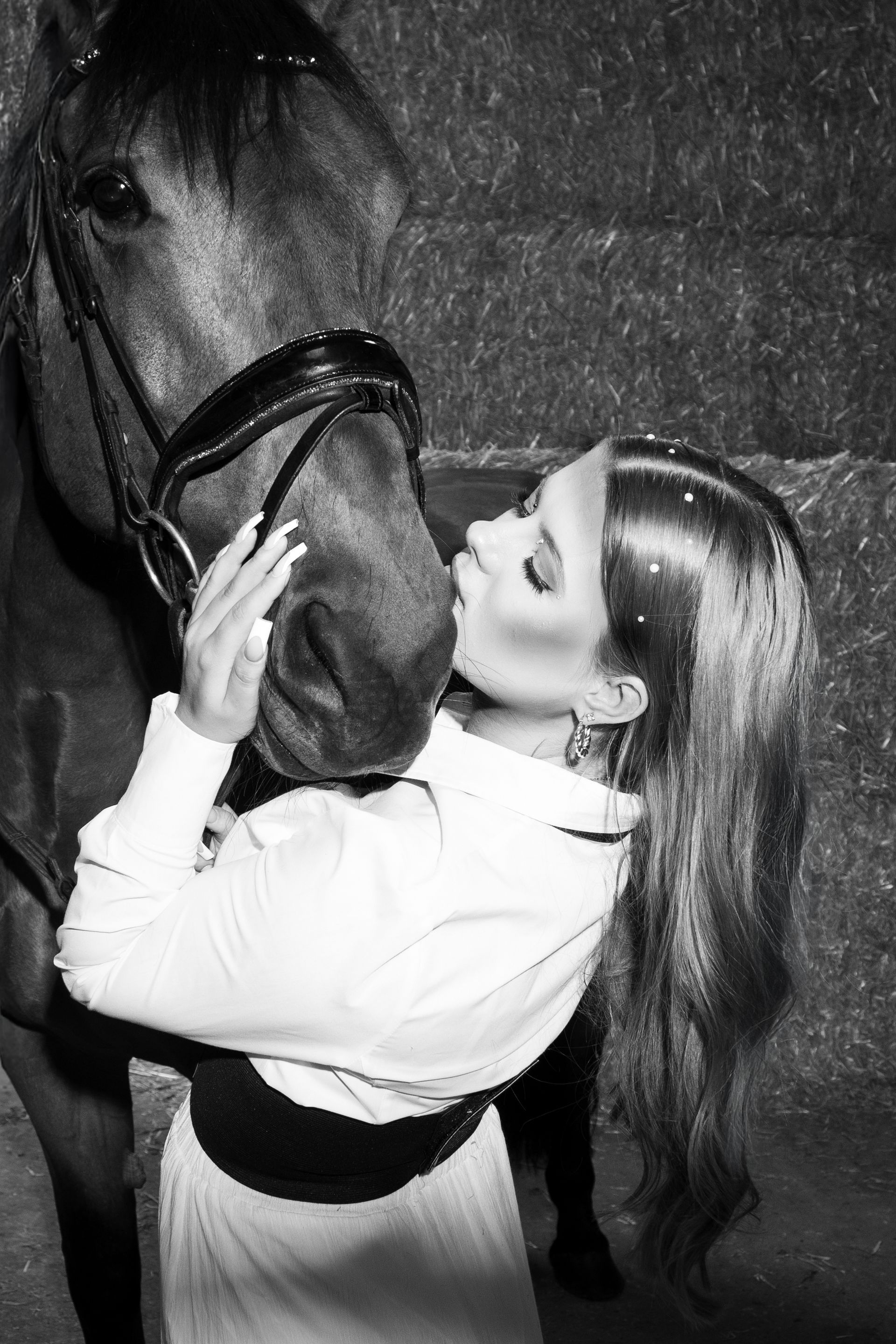 A woman is wearing a light blue top and shorts.