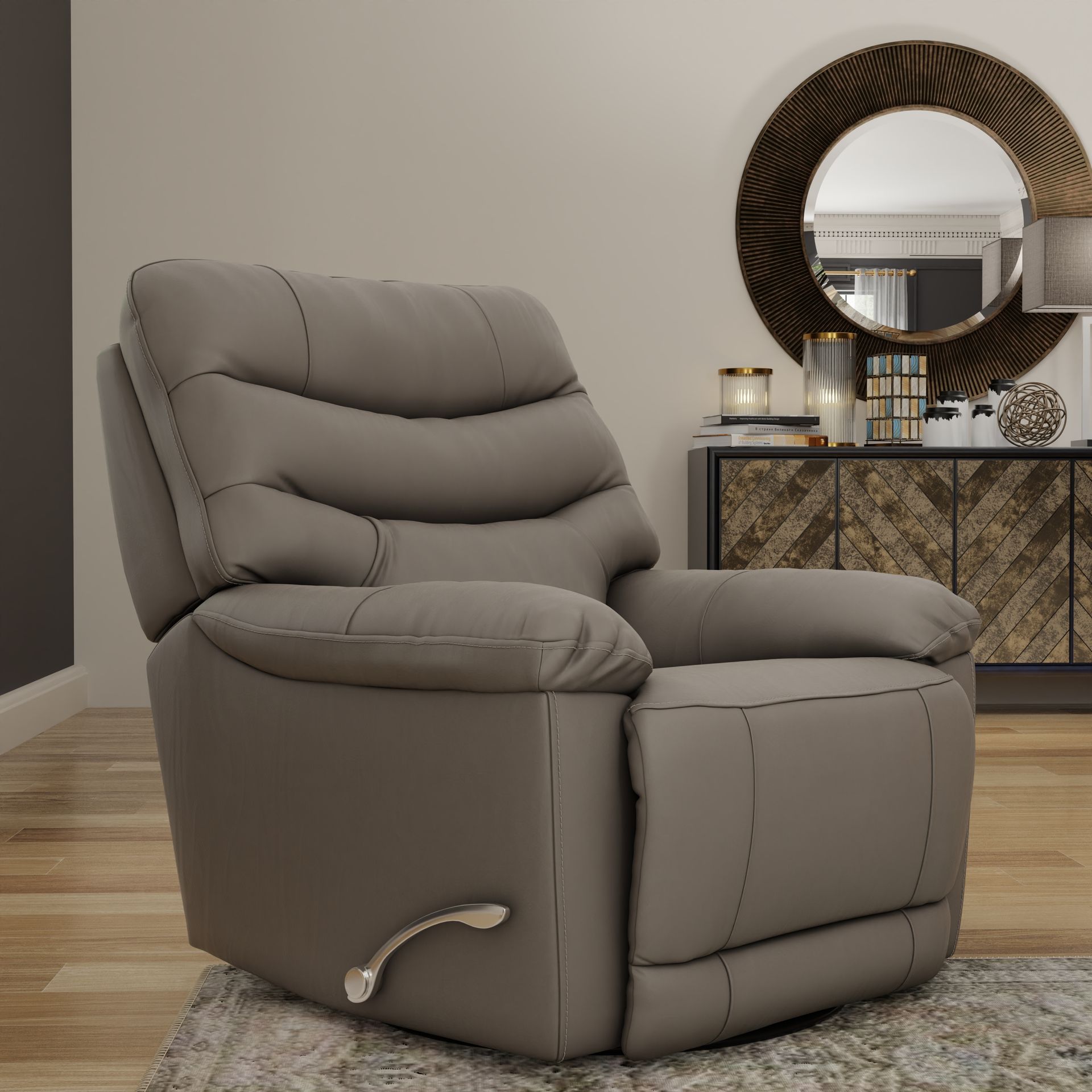 A taupe-colored recliner chair sits on a rug in a room with a decorative sideboard and a round mirror in the background.