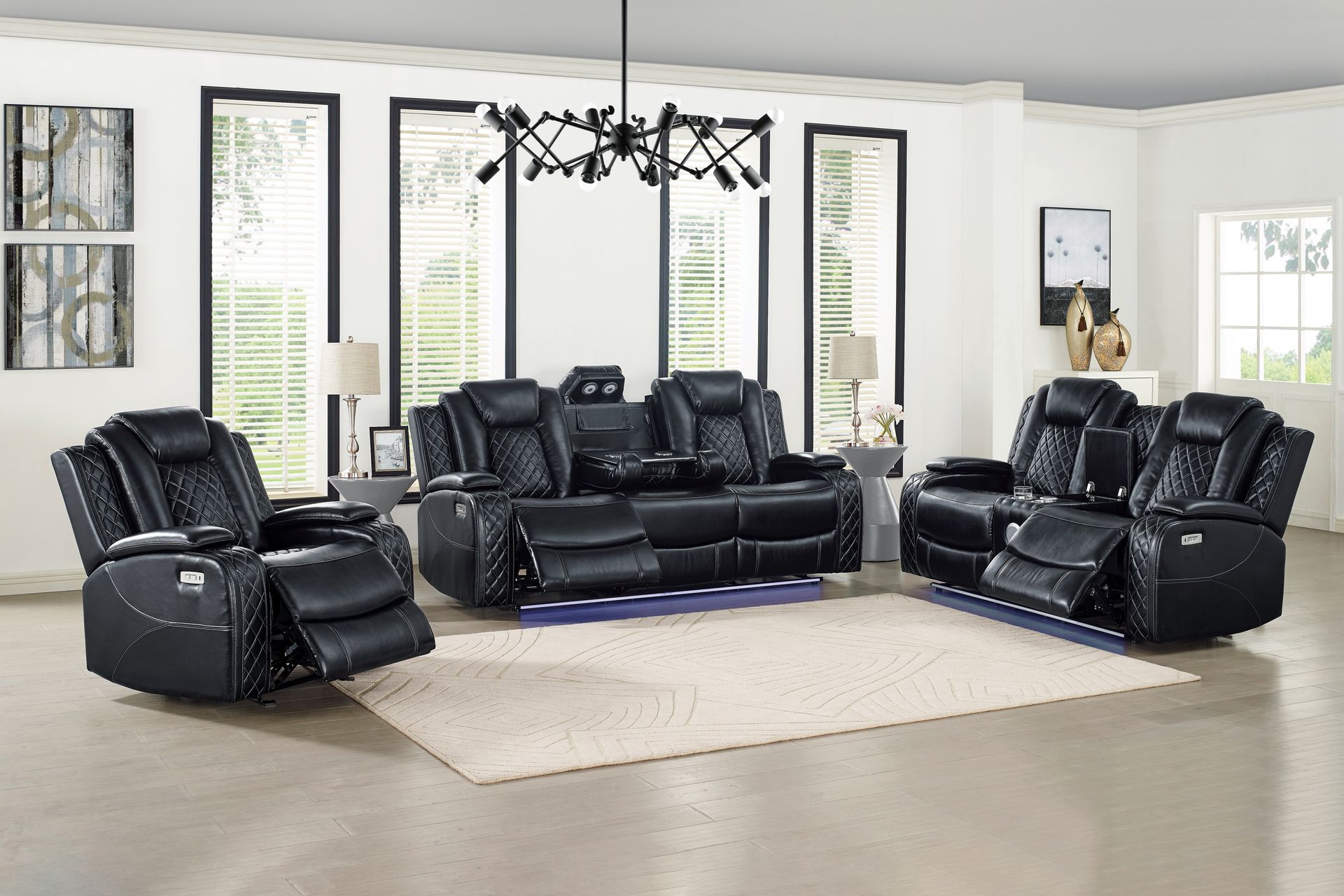 Black leather living room furniture set, including a recliner, a loveseat, and a sofa, on a light rug in a bright room.