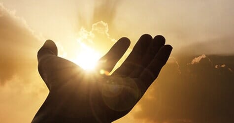 Hand On Sunset Background - Funeral Services in Brooklyn NY