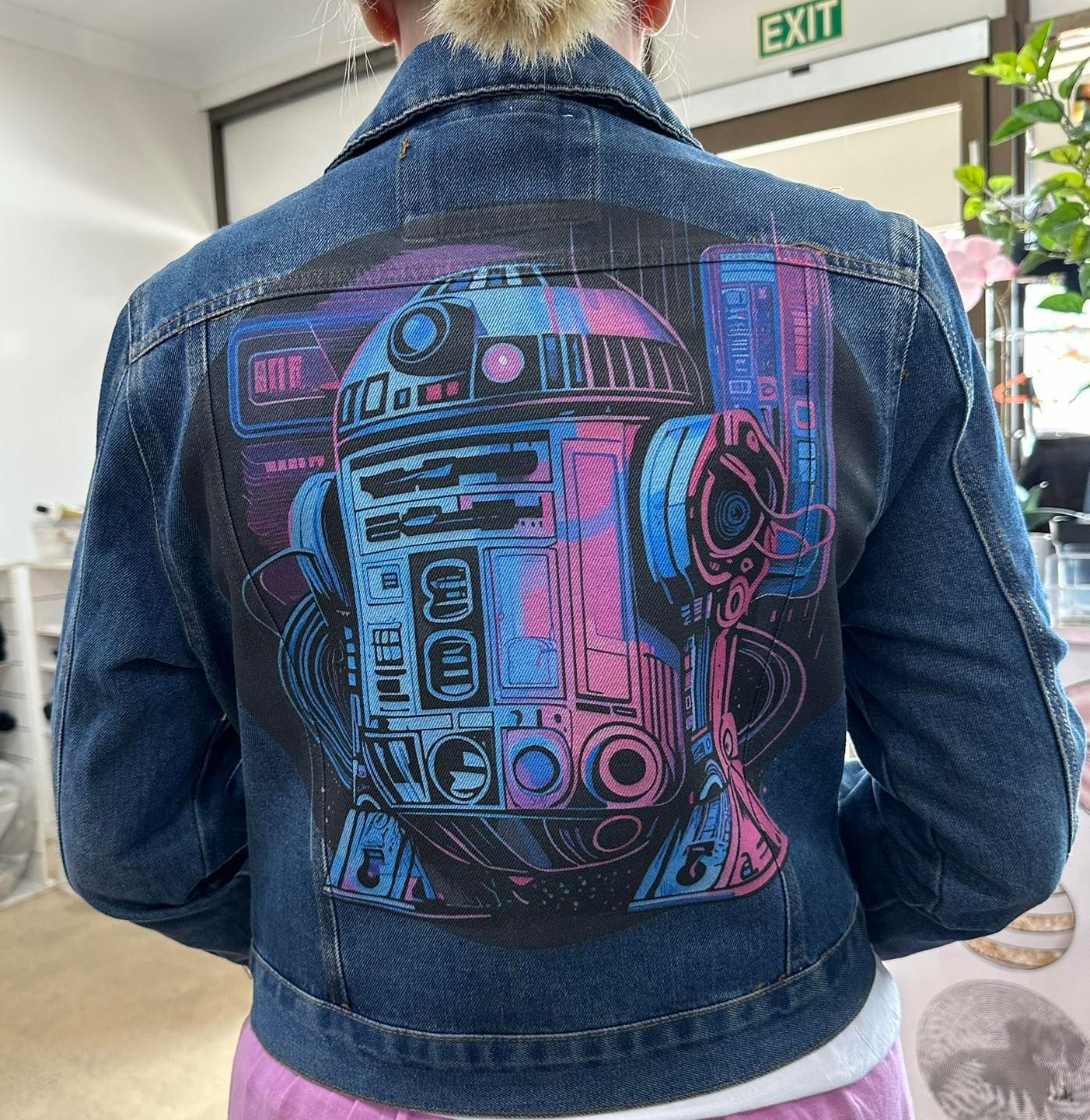 Jean jacket with an R2-D2 graphic in pink, blue, and black.— That Printed Vinyl Place in Heatley, QLD