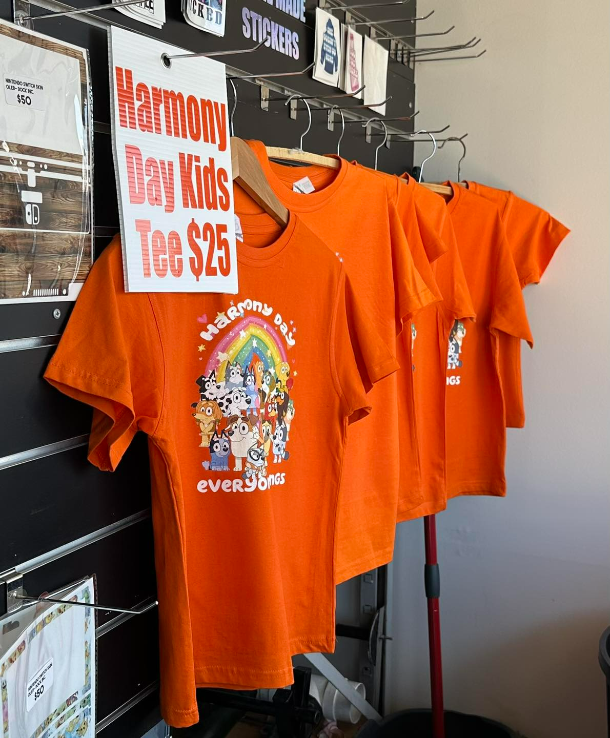 Orange T-shirts on a Rack — That Printed Vinyl Place in Heatley, QLD