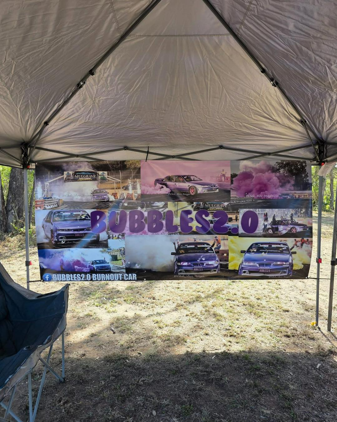 Banner Under a Tent With Car Photos, Reads — That Printed Vinyl Place in Heatley, QLD