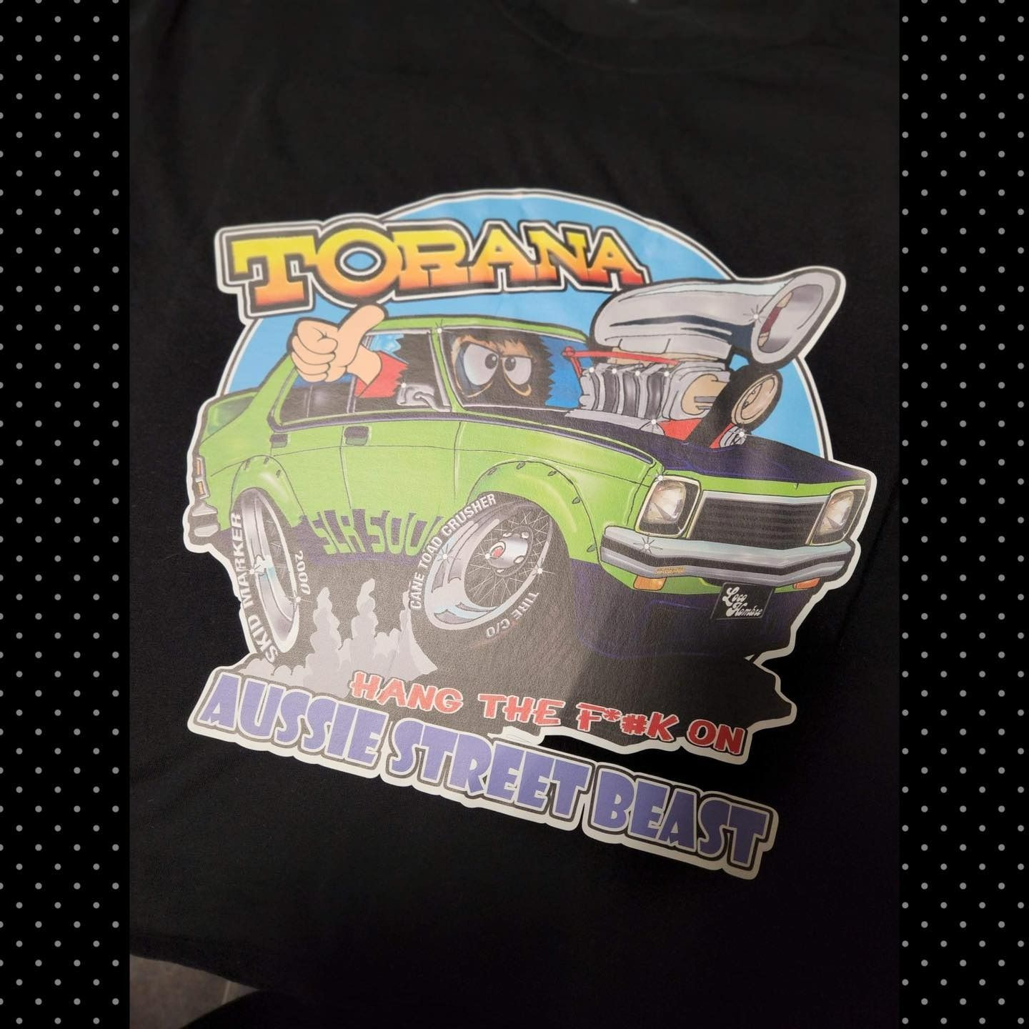Black T-shirt With Cartoon of a Green Torana Car With a Large Engine — That Printed Vinyl Place in Heatley, QLD