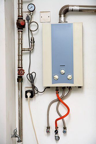Plumbing Professionals — Tankless Water Heater in Oak Creek, WI