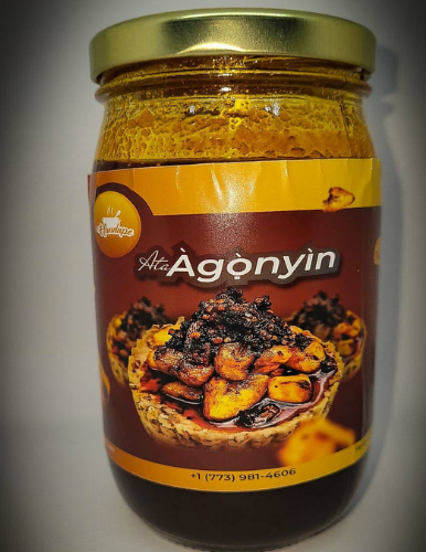 A jar of agonyin is sitting on a table.