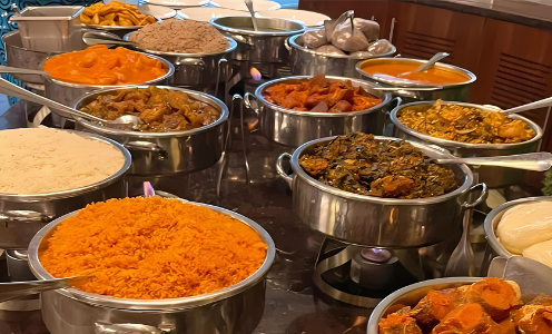 A buffet table filled with lots of different types of food