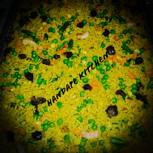 A close up of rice and vegetables with handdate kitchen written on the bottom