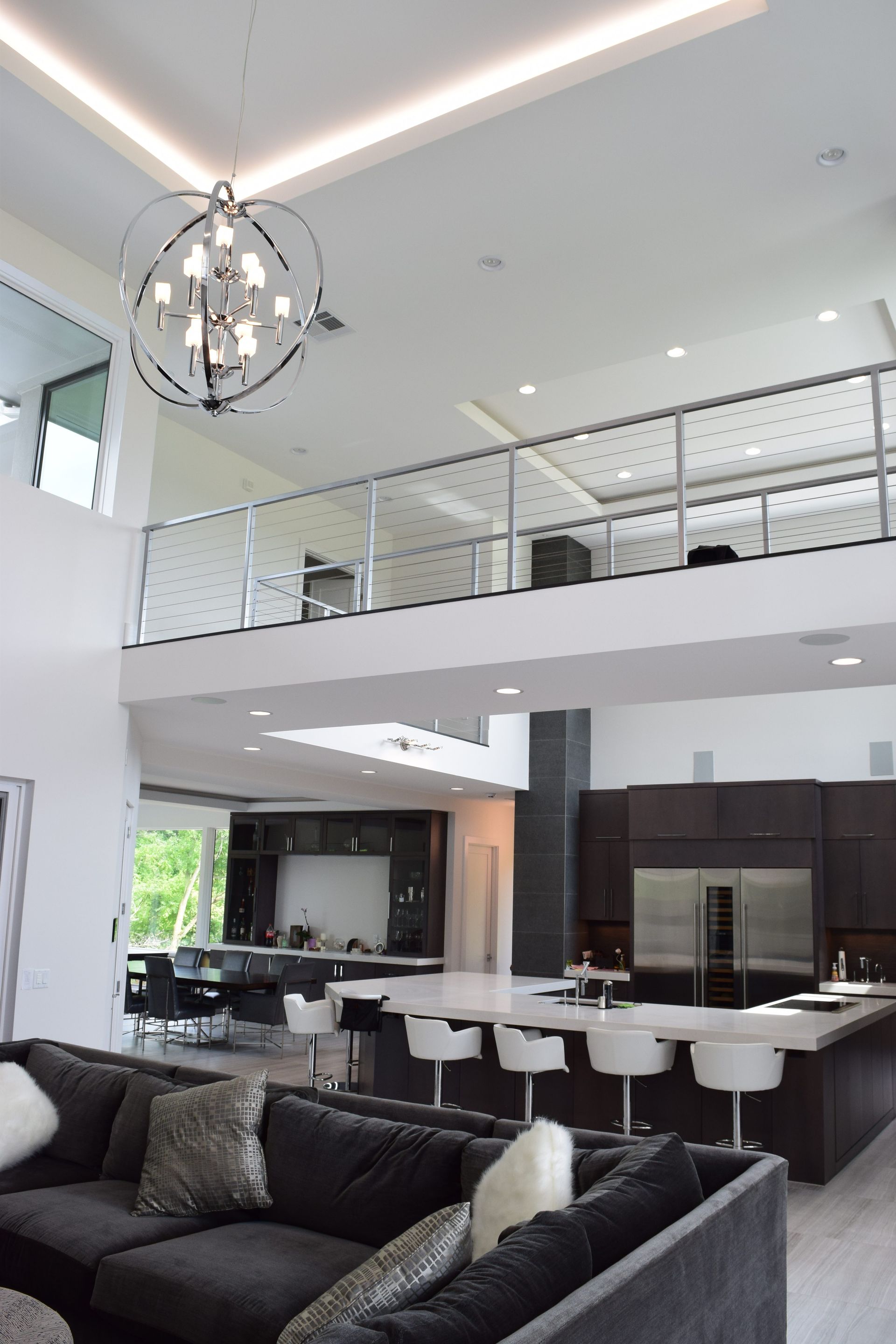 A Living Room With A Couch And A Chandelier - Carmel, IN - Goldberg Design Group