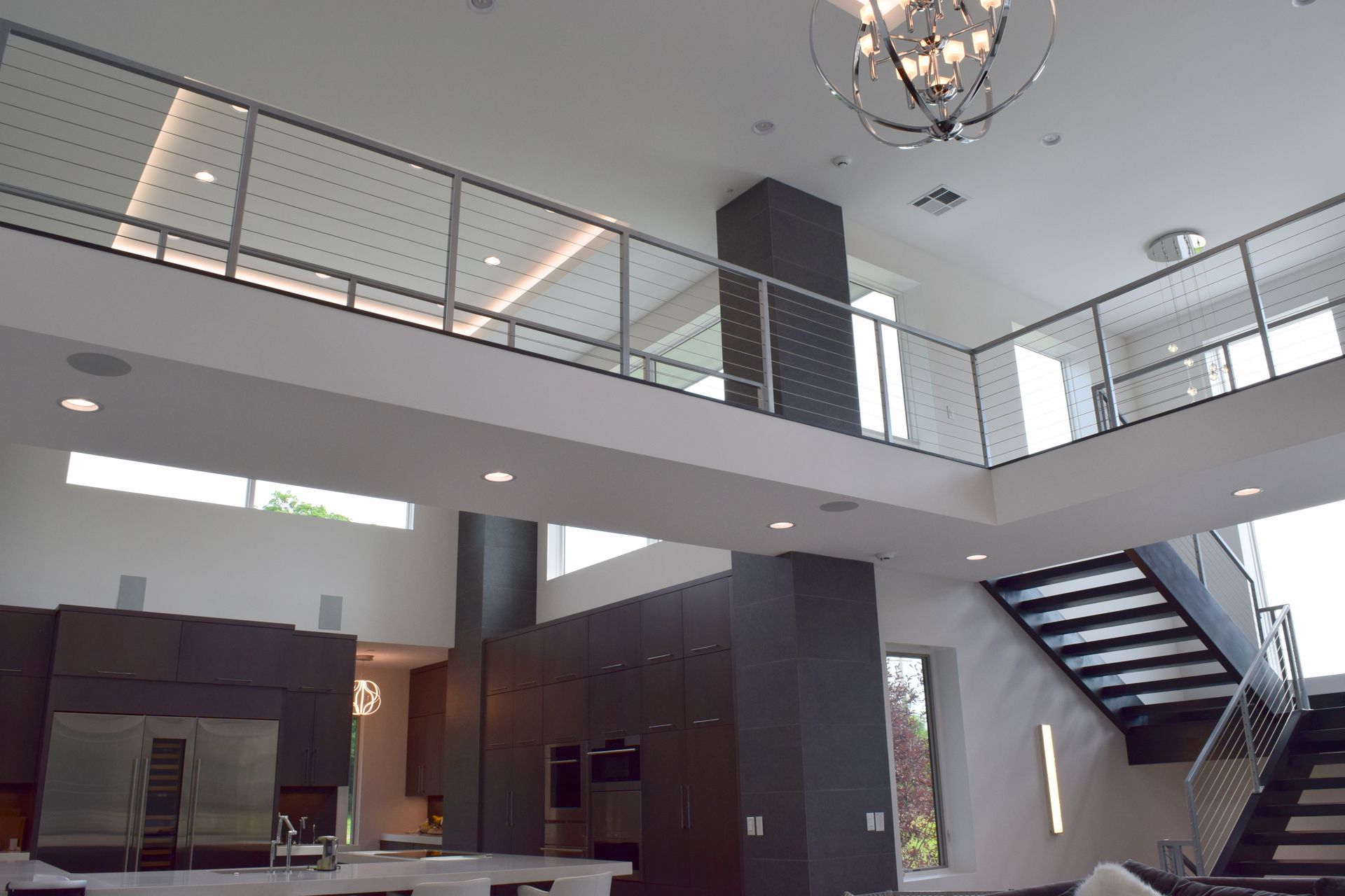 a large house with a balcony and stairs