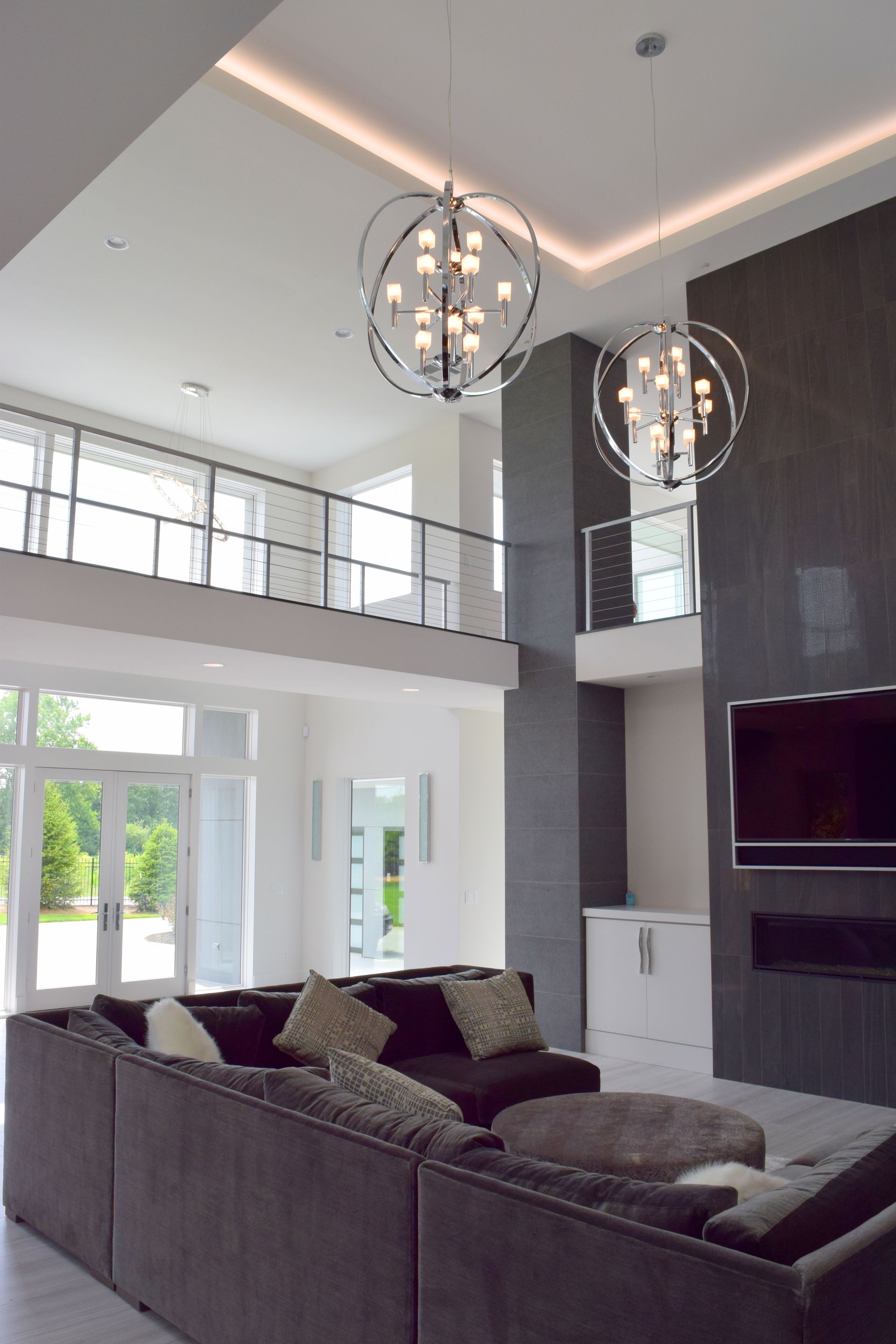 A Living Room With A Couch And A Television - Carmel, IN - Goldberg Design Group