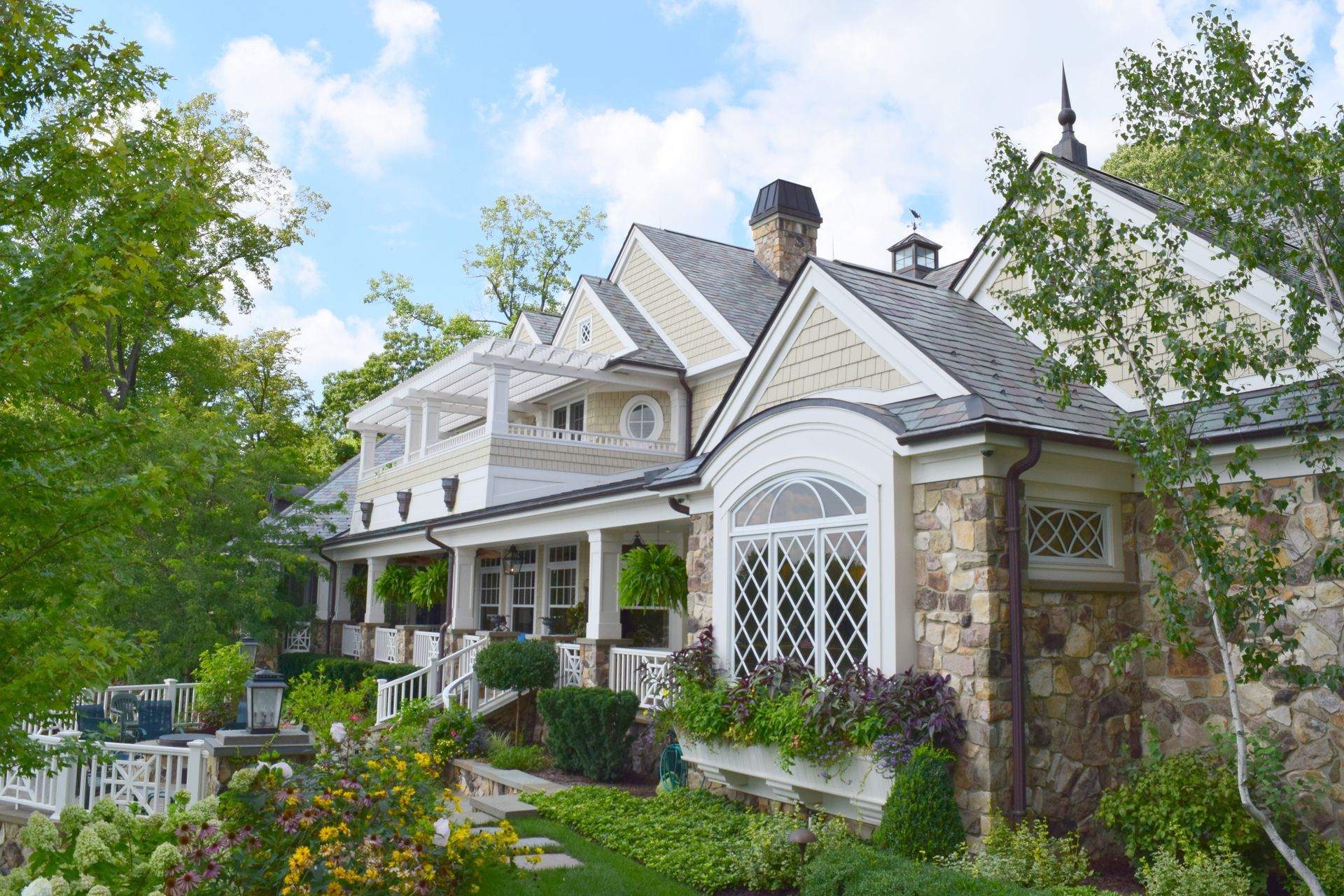 A Large White House With A Gray Roof - Carmel, IN - Goldberg Design Group