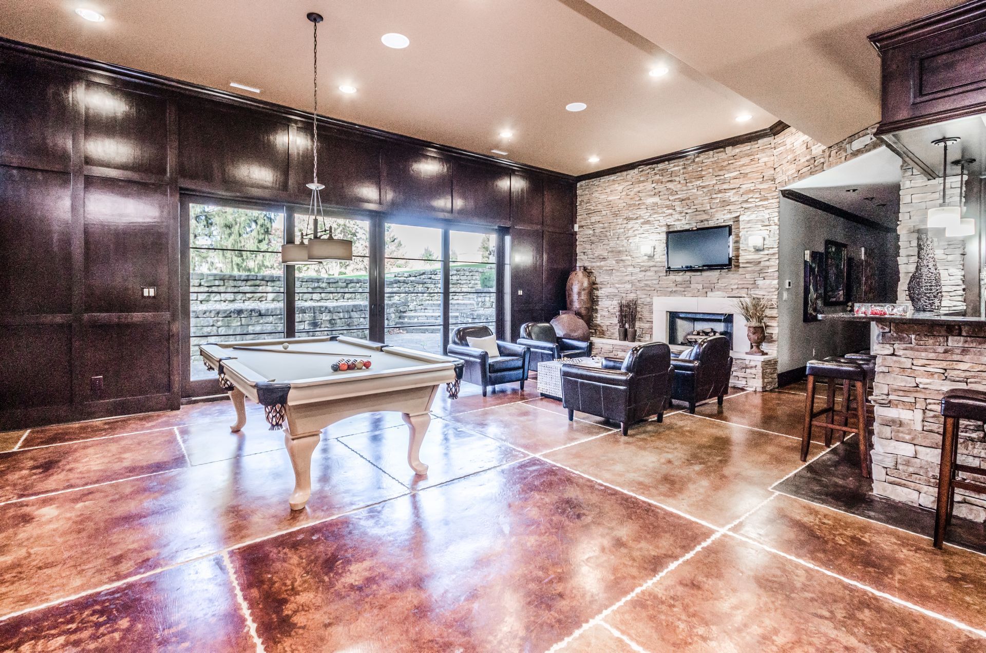 There Is A Pool Table In The Middle Of The Room - Carmel, IN - Goldberg Design Group