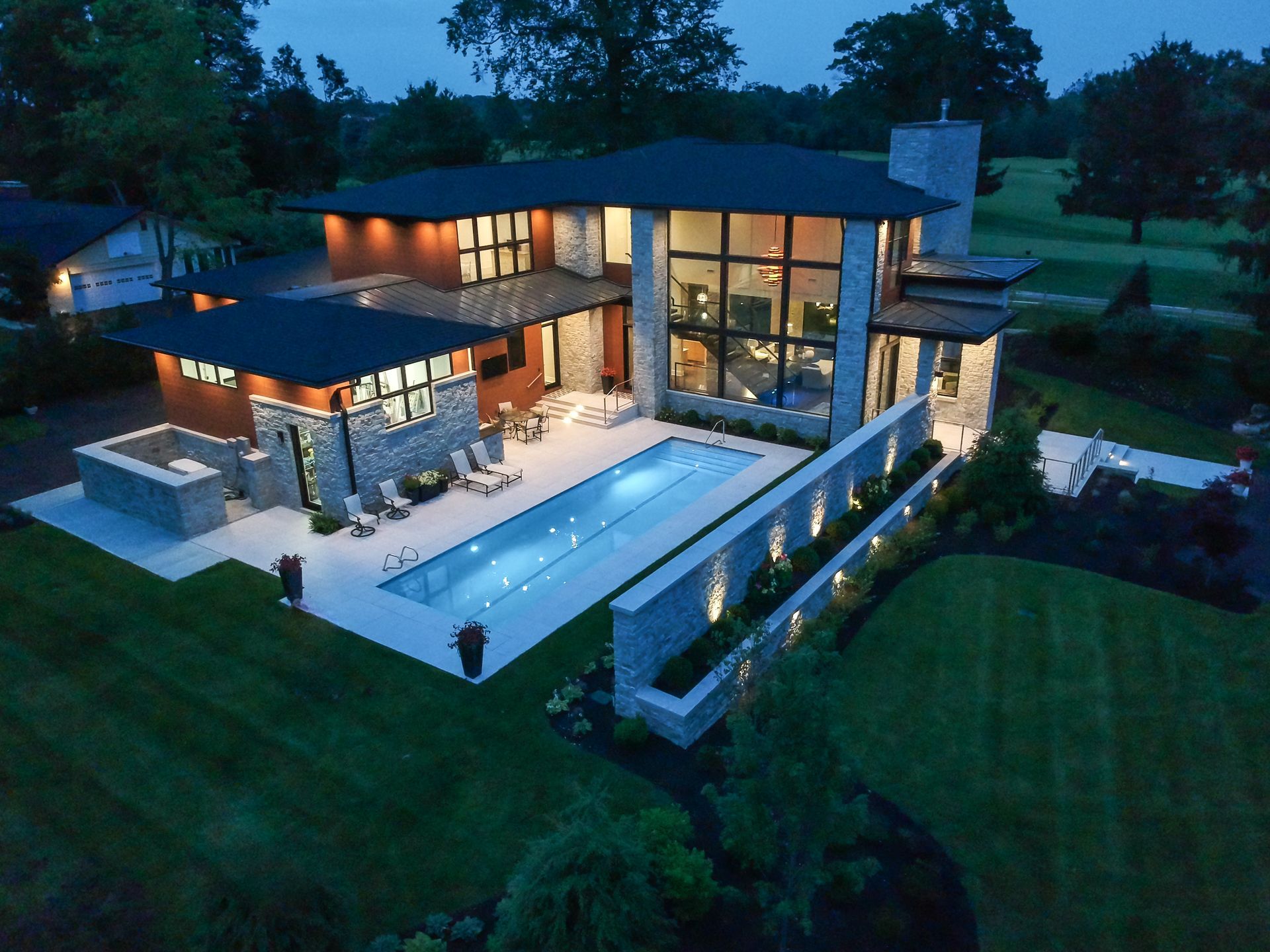 An Aerial View Of A House With A Large Swimming Pool - Carmel, IN - Goldberg Design Group
