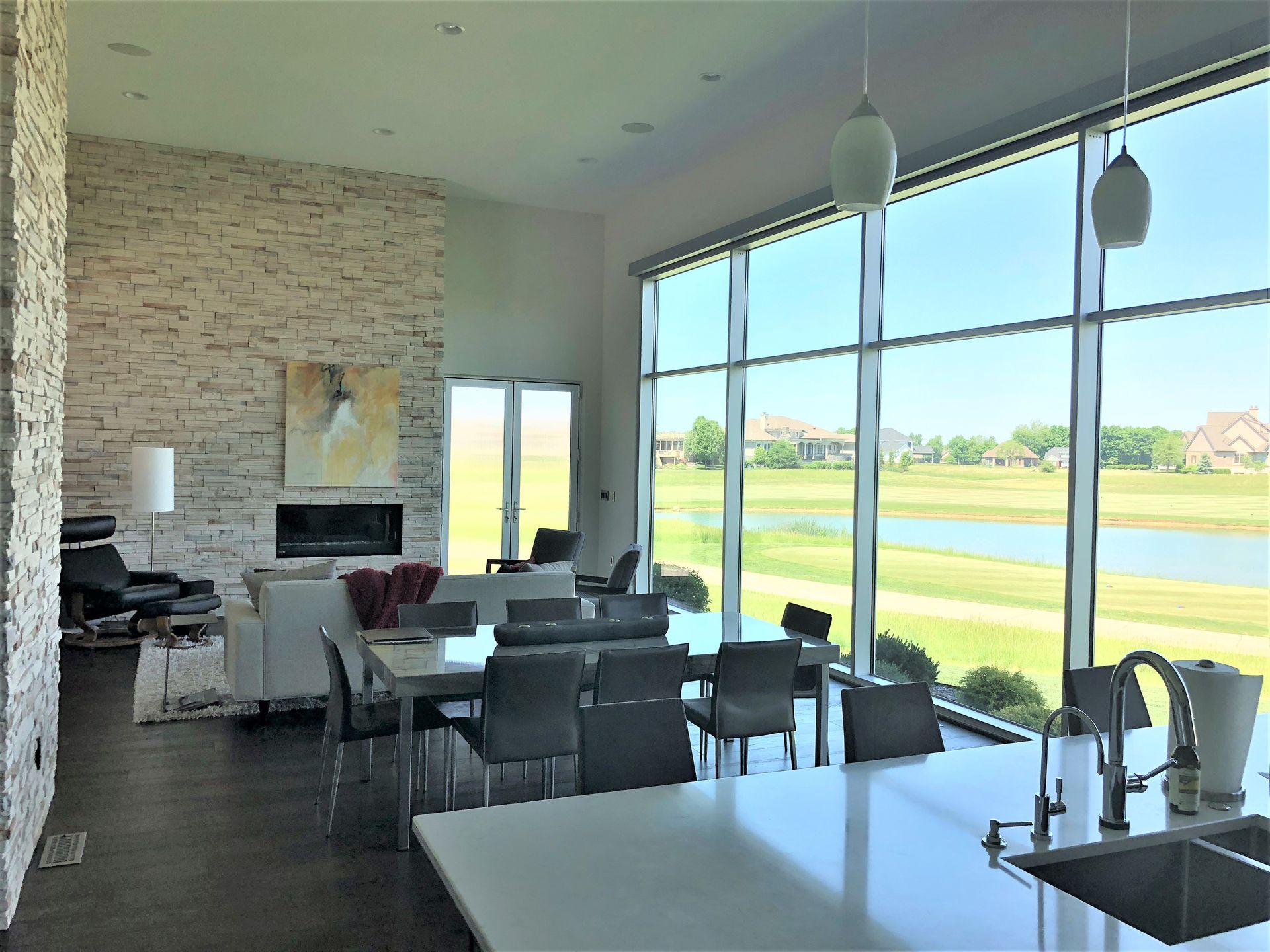 A Living Room With A Dining Table - Carmel, IN - Goldberg Design Group