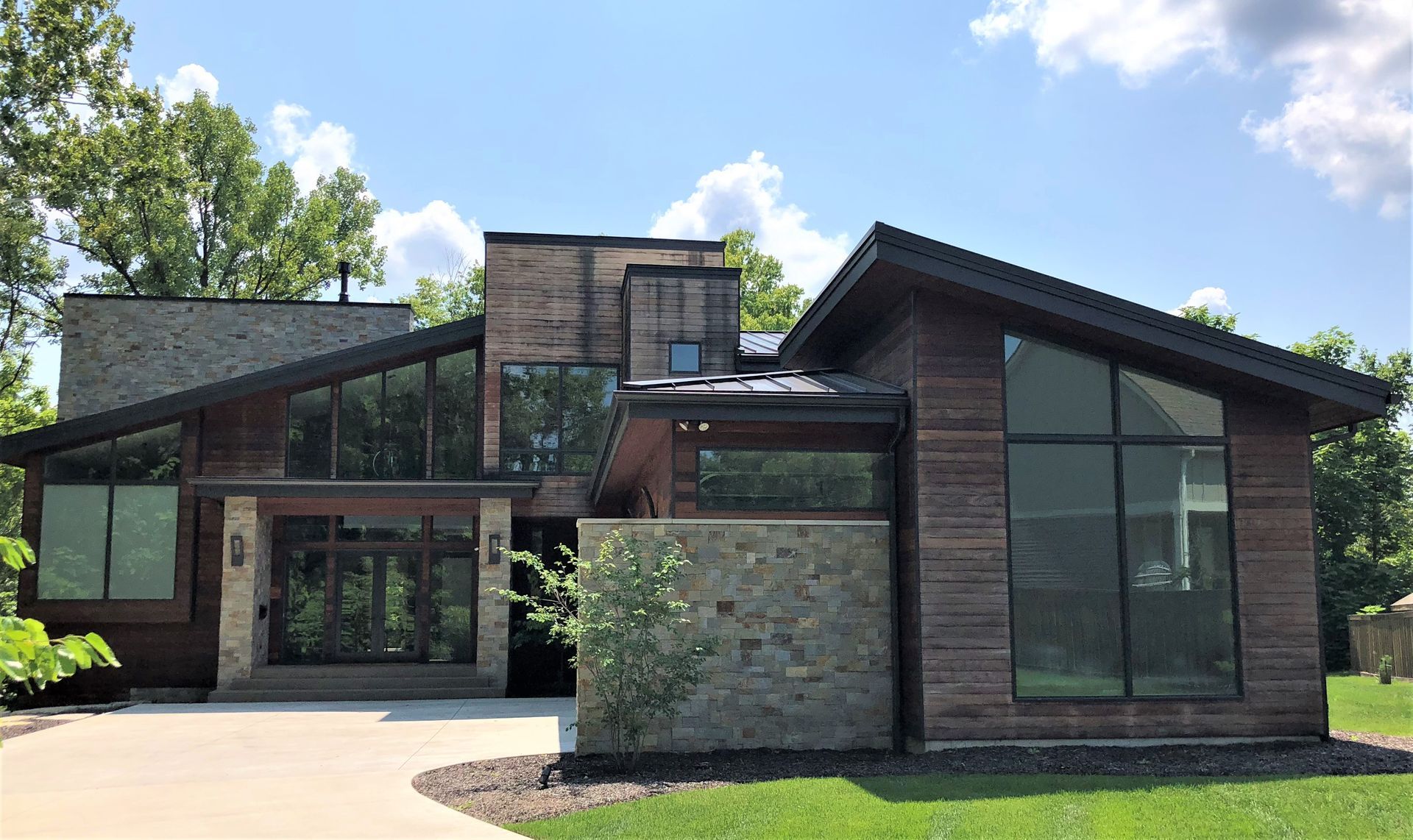 A Large Modern House With A Lot Of Windows - Carmel, IN - Goldberg Design Group