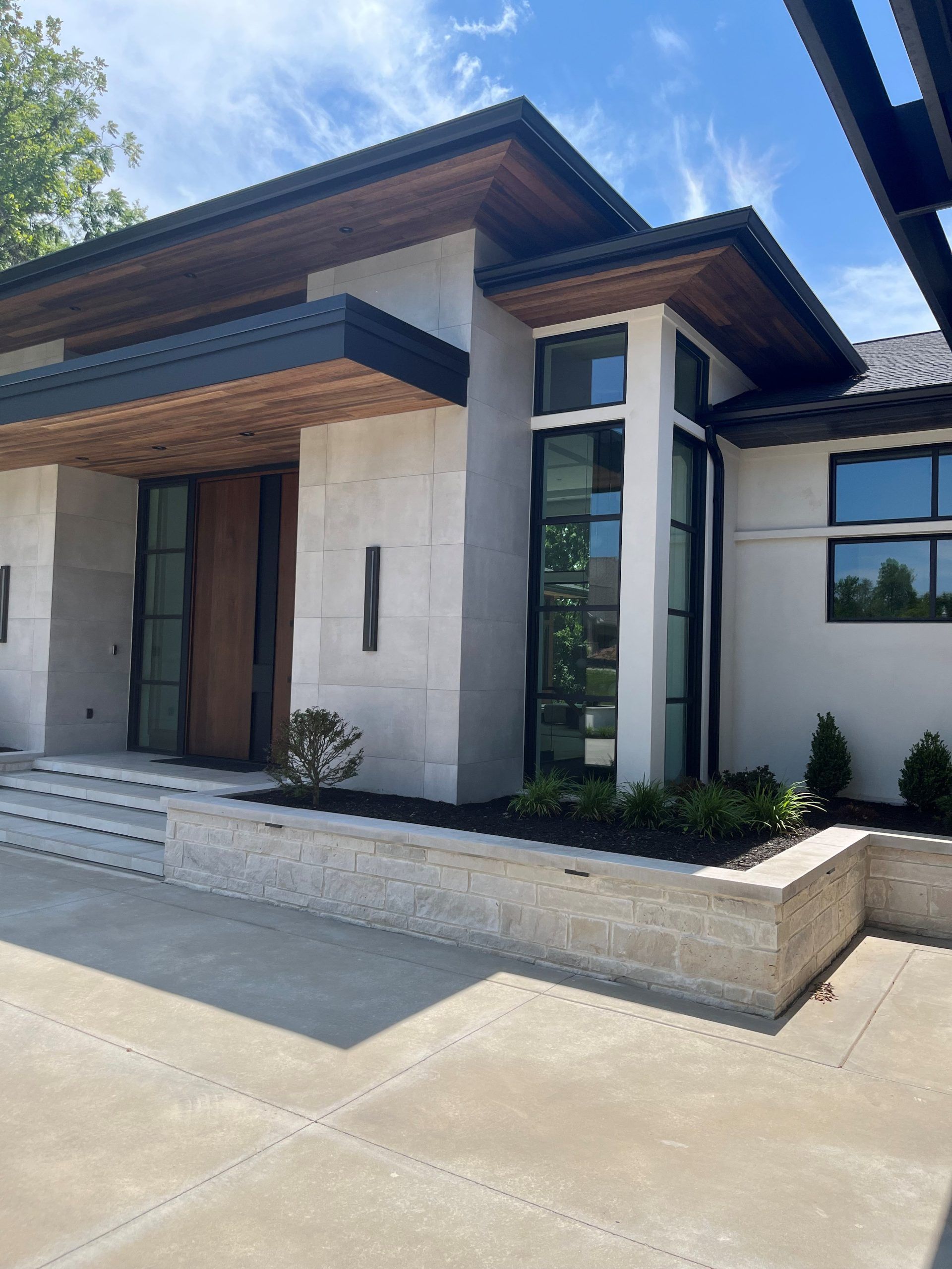 A White House With A Wooden Roof - Carmel, IN - Goldberg Design Group
