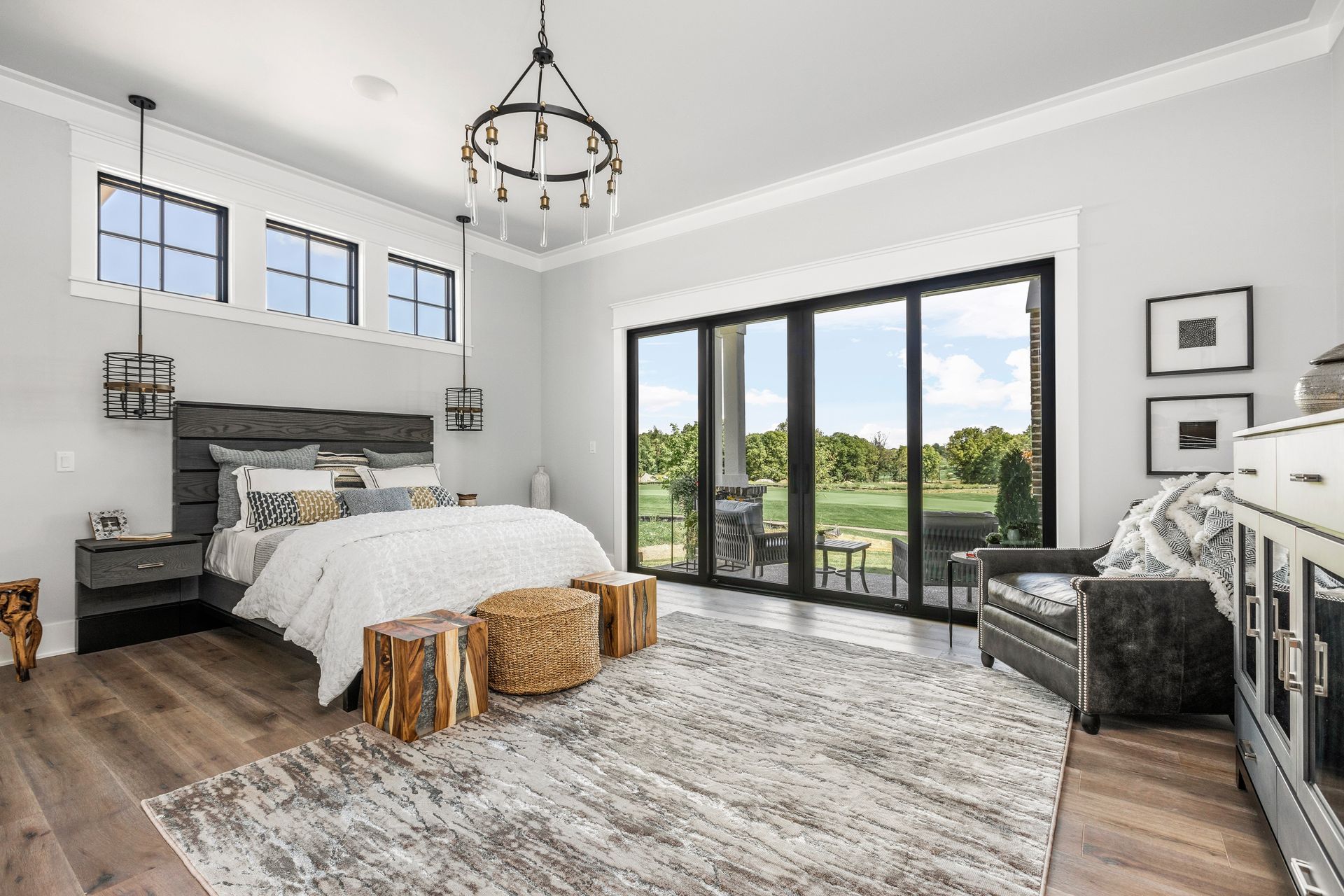 A Bedroom With A Large Bed - Carmel, IN - Goldberg Design Group