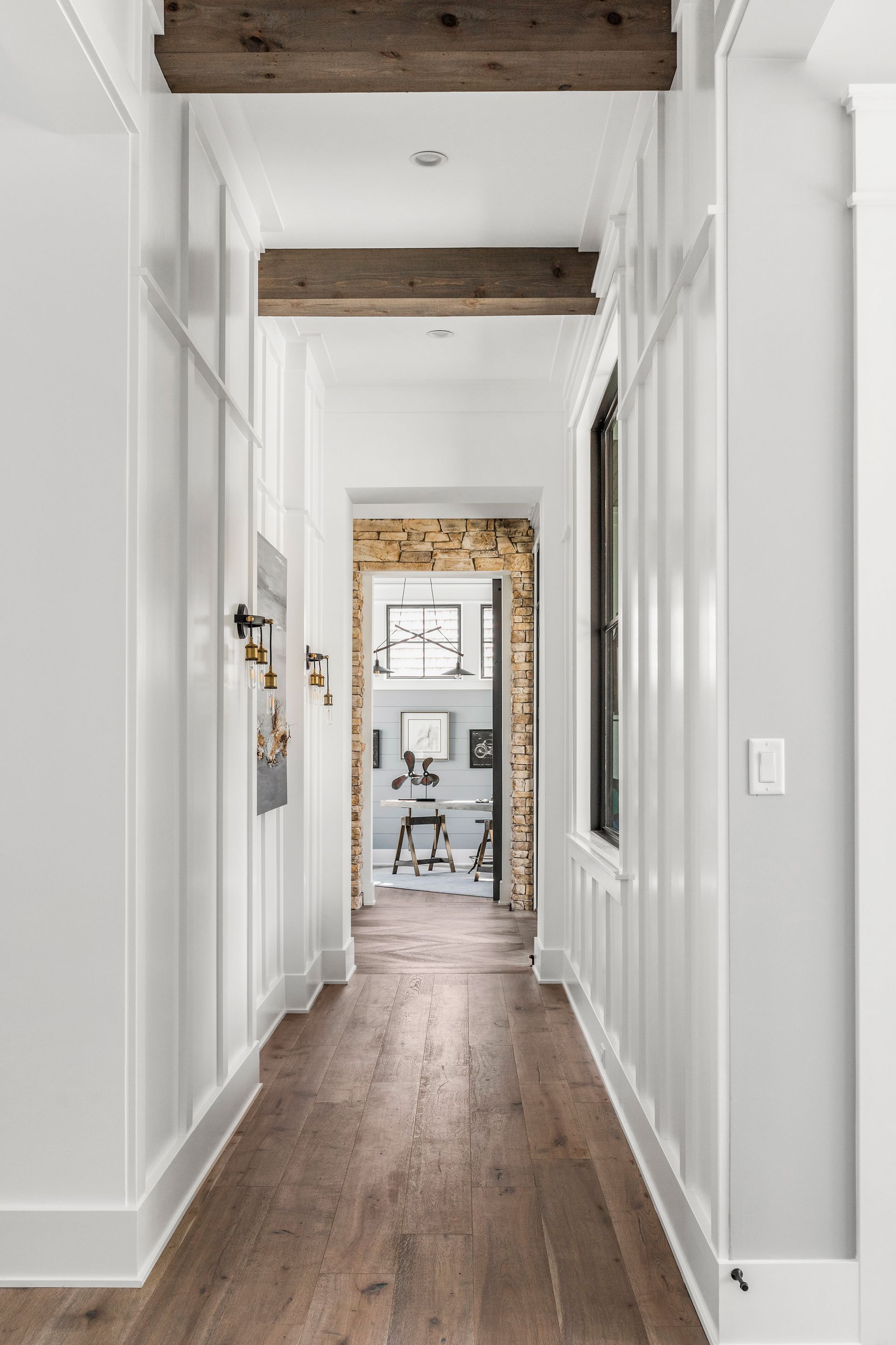A Long Hallway With Hardwood Floors - Carmel, IN - Goldberg Design Group
