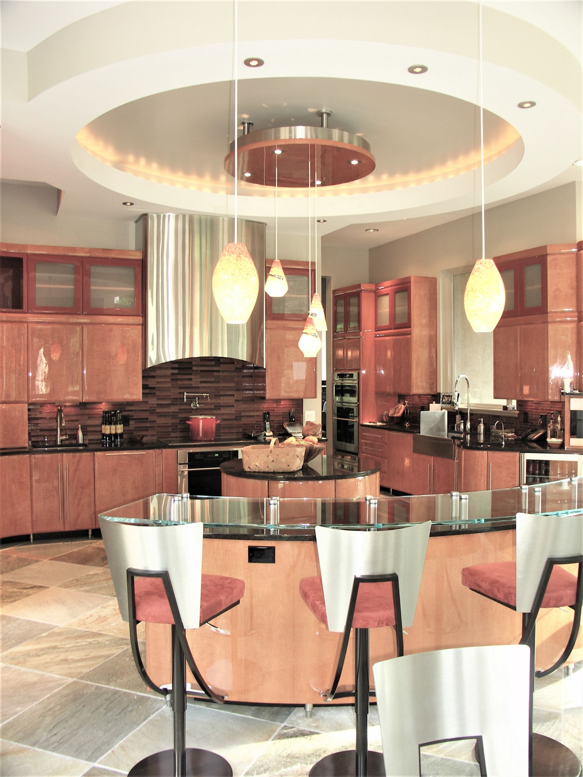 A Kitchen With A Round Glass Table And Chairs - Carmel, IN - Goldberg Design Group