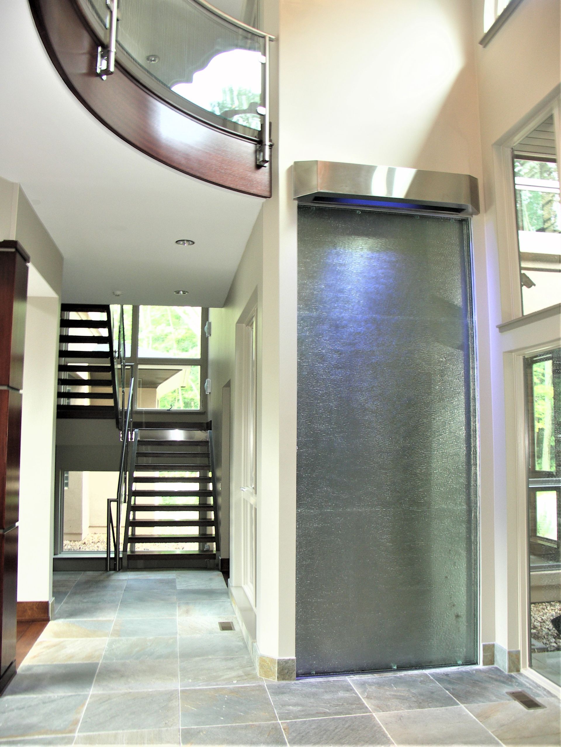 A Hallway With Stairs And An Elevator - Carmel, IN - Goldberg Design Group