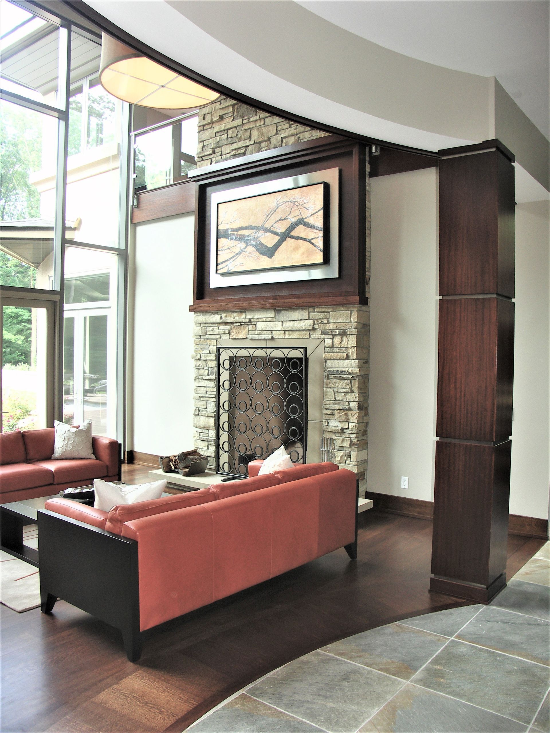 A Living Room With A Fireplace And A Couch - Carmel, IN - Goldberg Design Group